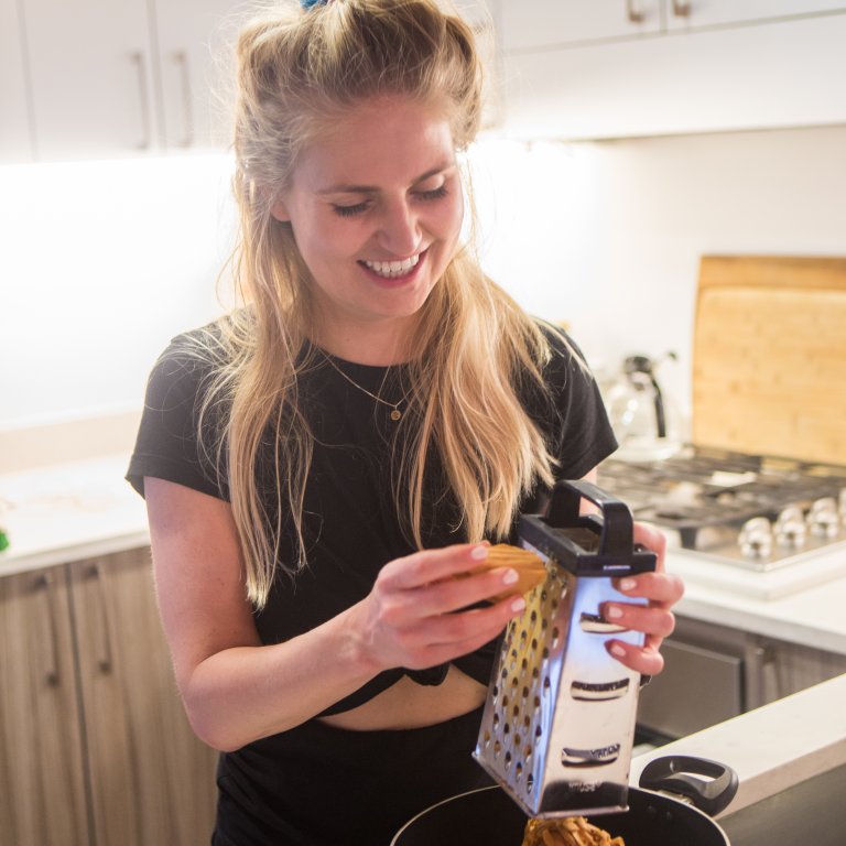 Mette preparing brunost for tonight's party