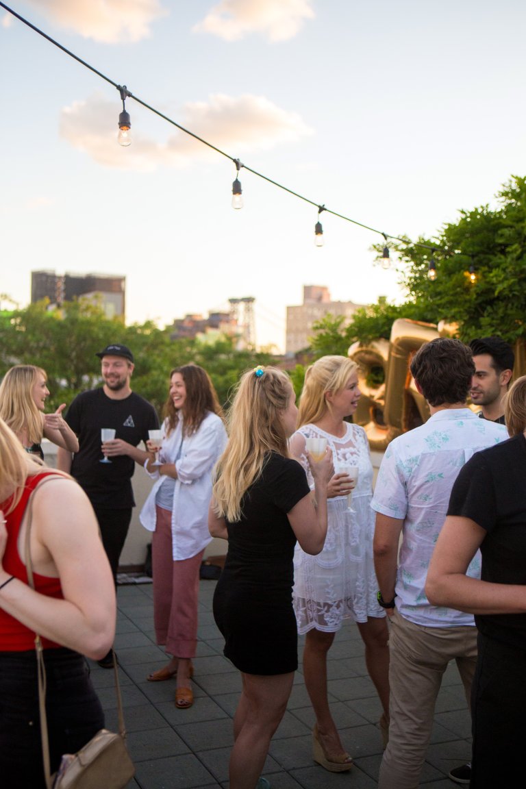 Guests arrive at the rooftop bar