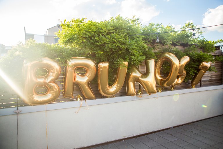 Brunost in gold letters on a rooftop in Brooklyn