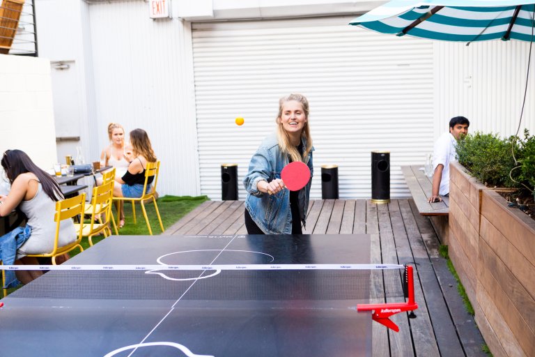 Mette playing table tennis in Brooklyn